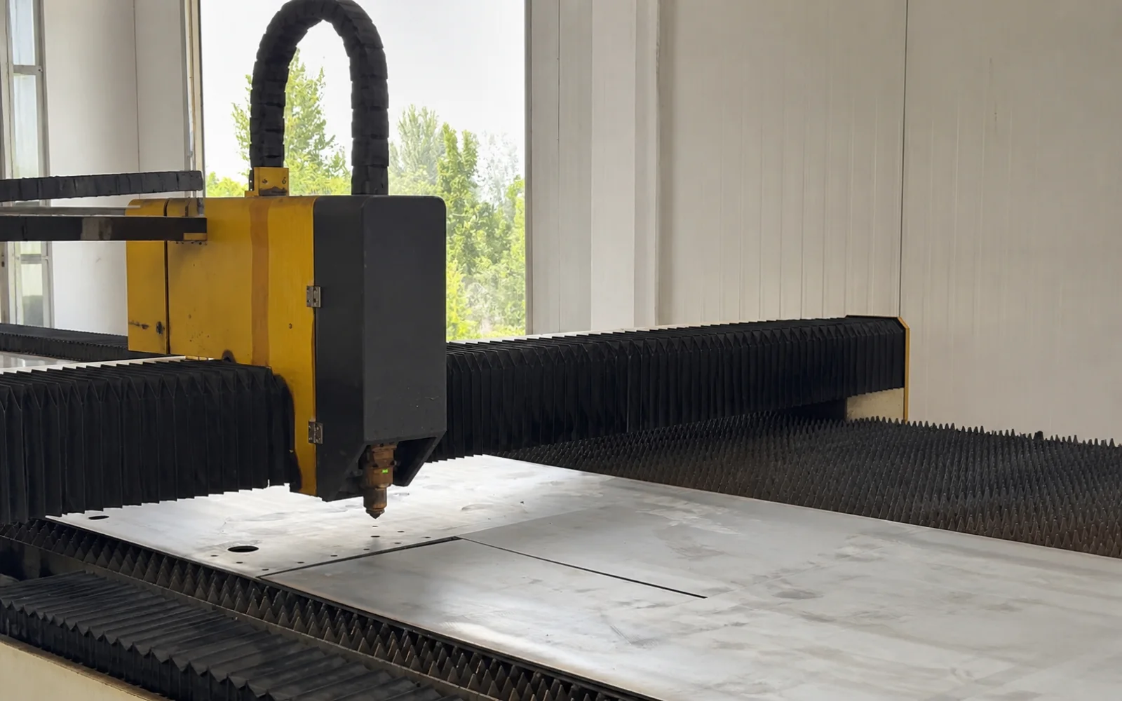 CNC laser cutting sheet steel for transformer tank fabrication