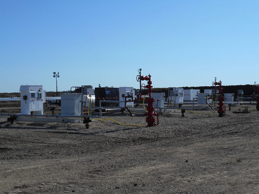 Real multiple-well ESP pad with surface control and power equipment
